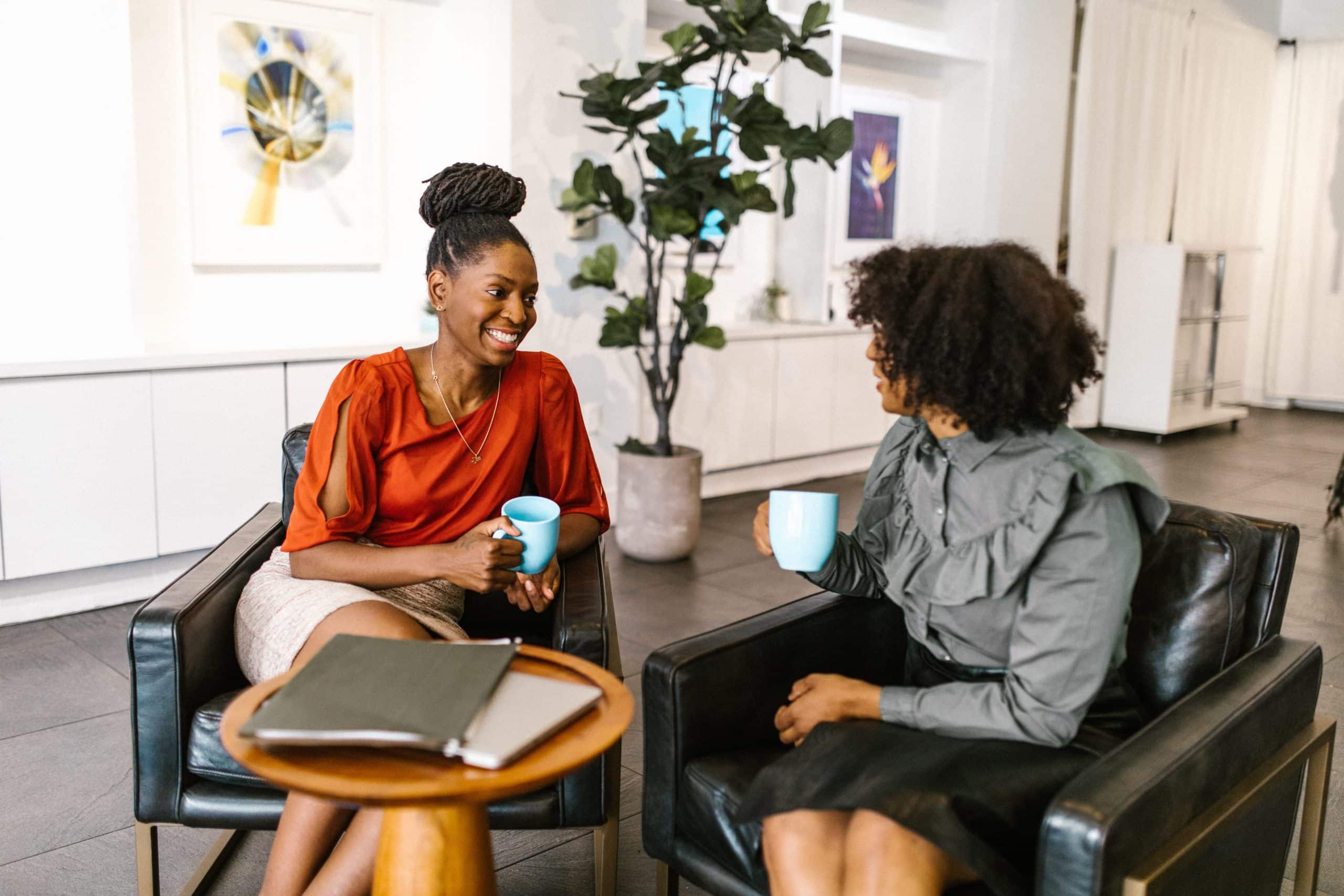 Two women discussing donor management.